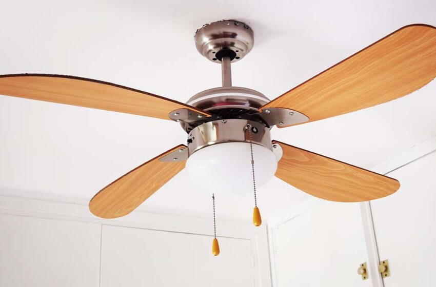 A ceiling fan hanging in a room